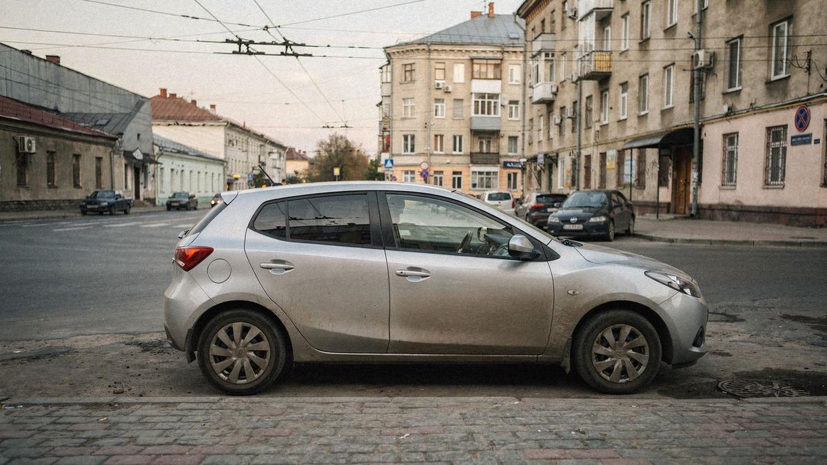 Compact rental hatchback parked on a side street in central Kyiv